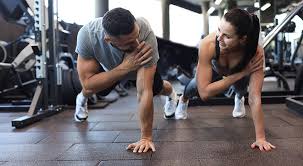 Toning Bingo Wings: Your Ultimate Guide to Sculpting Sleek Arms at the Gym 3 Fitness trainer demonstrating arm toning exercises Windsor